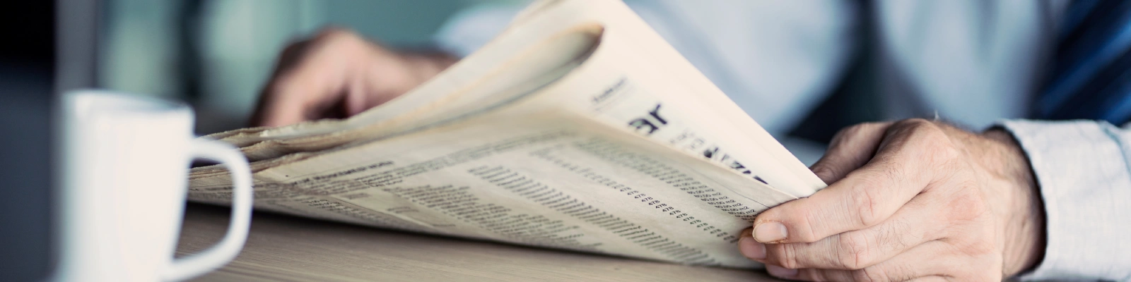 man holding a newspaper